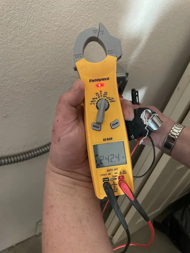 Voltage testing with clamp meter during Ceiling Fan Installation in Paramount